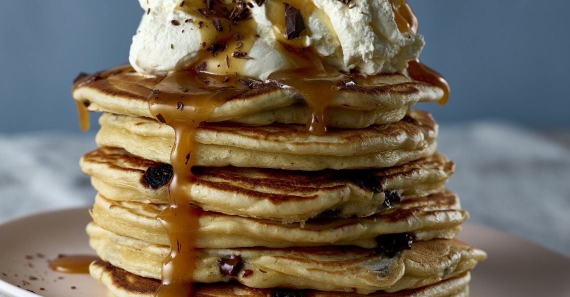 Chocolate chip pancakes with whipped cream and rum caramel sauce Egg